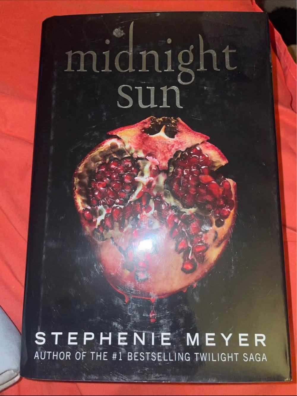 Midnight Sun by Stephenie Meyer - Black Cover with Red Pomegranate